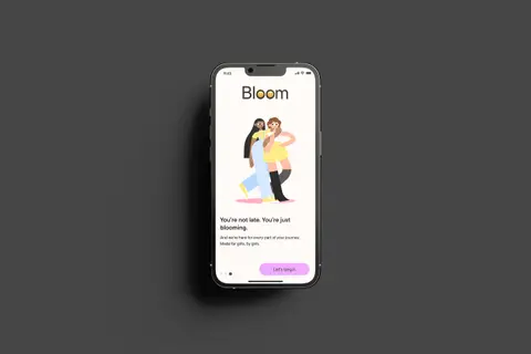 Phone showing the Bloom app with an illustration of two girls